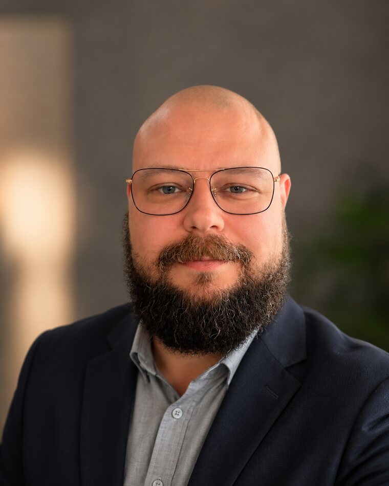 Portrait of Asbjørn Birch, DevOps Lead